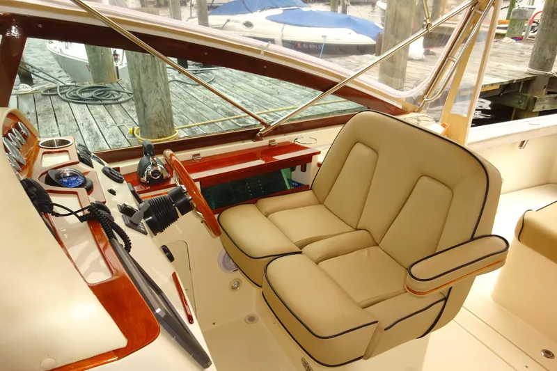 Slide: The Image of 2009 Hunt Yachts Harrier 29 cockpit with luxurious seating and polished controls. - 35