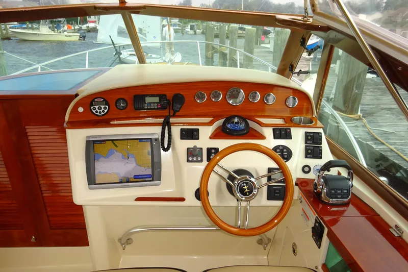 Slide: The Image of 2009 Hunt Yachts Harrier 29 helm with GPS, gauges, and wooden steering wheel. - 37