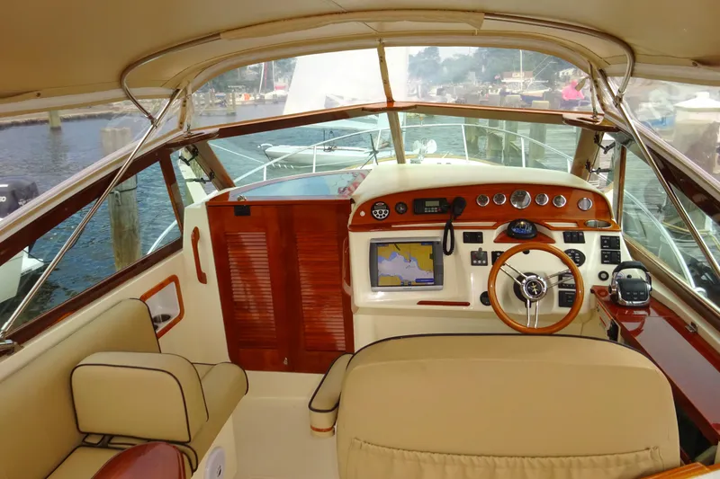 Slide: The Image of 2009 Hunt Yachts Harrier 29 cockpit with wooden dashboard and navigation equipment. - 38