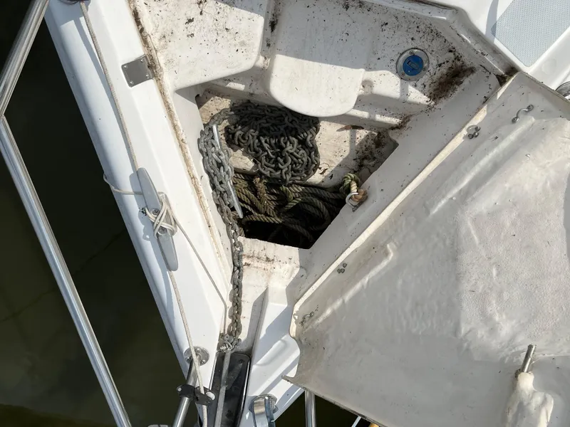 Slide: The Image of Anchor locker of a 2000 Hunter 340 sailboat with chain and rope. - 10