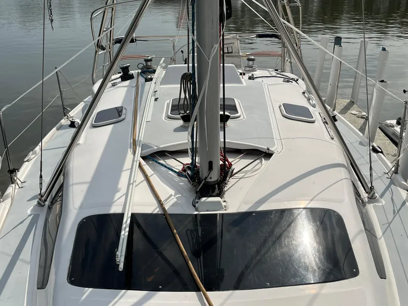 Slide: The Image of Deck view of a 2000 Hunter 340 sailboat, showing rigging and hatches. - 11