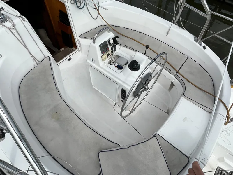 Slide: The Image of Cockpit of 2000 Hunter 340 sailboat with steering wheel and navigation instruments. - 14