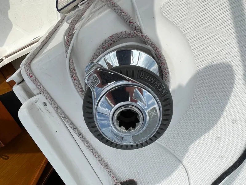 Slide: The Image of Winch on 2000 Hunter 340 sailboat deck with coiled rope. - 16