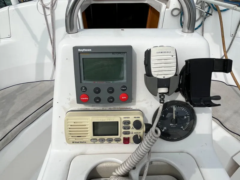 Slide: The Image of Control panel of a 2000 Hunter 340 sailboat with navigation and communication equipment. - 20