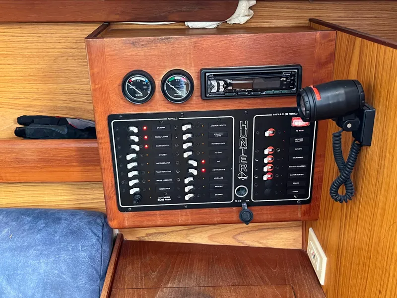 Slide: The Image of Control panel of a 2000 Hunter 340 sailboat with gauges and switches. - 30