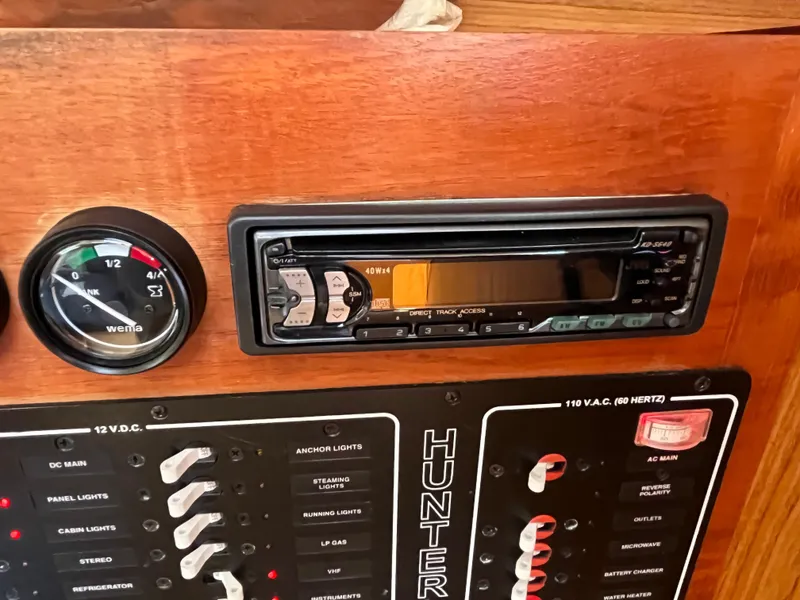 Slide: The Image of Control panel of a 2000 Hunter 340 boat with stereo and gauge. - 31