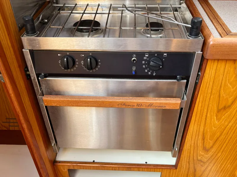 Slide: The Image of Stainless steel marine stove and oven in a 2000 Hunter 340 sailboat galley. - 39