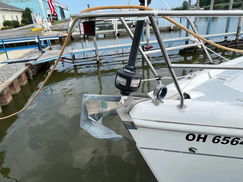Slide: The Image of Hunter 340 sailboat from 2000 docked, showing anchor and bow details. - 8