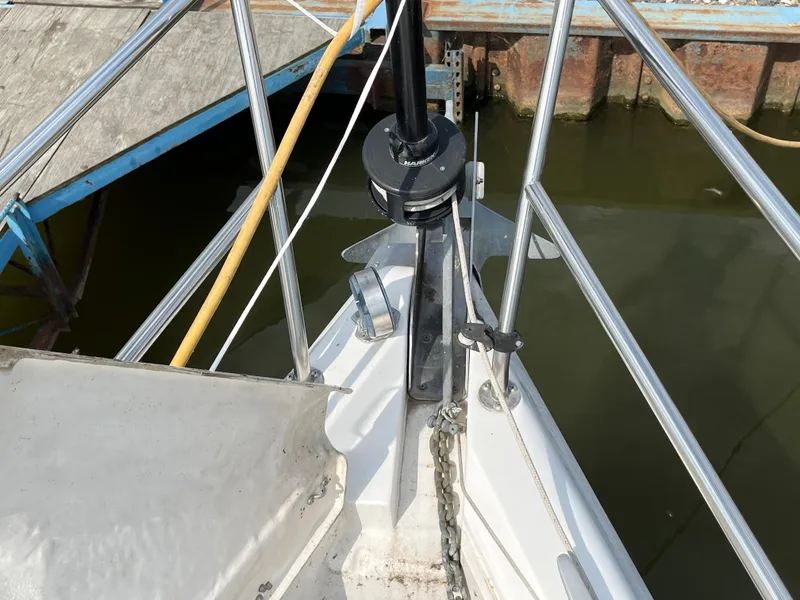 Slide: The Image of Bow of a 2000 Hunter 340 sailboat with anchor and railing at dock. - 9