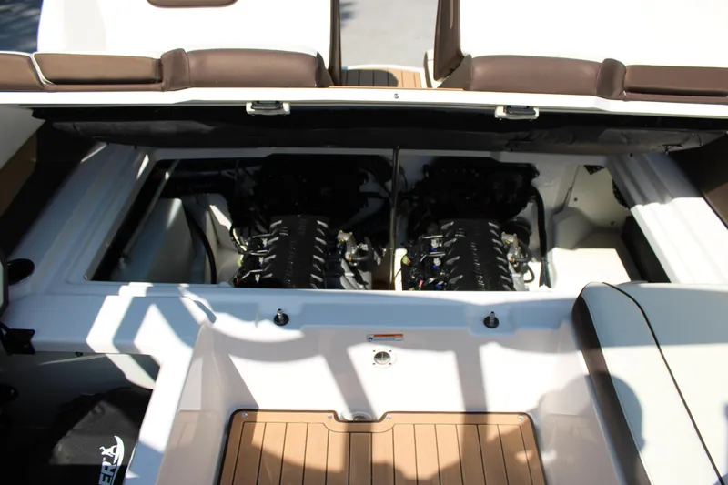 Slide: The Image of 2022 Yamaha Boats 252S engine compartment with dual engines and seating area. - 19