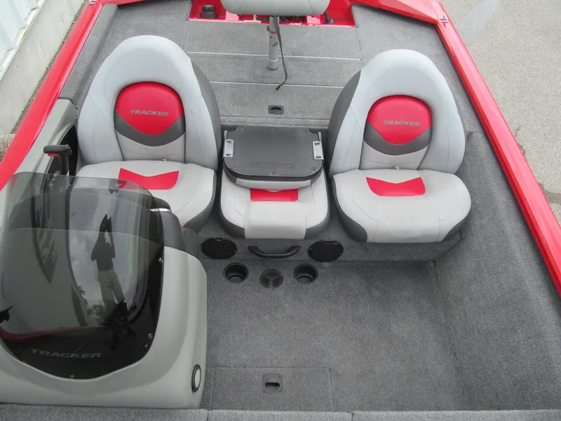 Slide: The Image of 2014 Tracker Pro Team 175 TXW boat interior with red and gray seating. - 10