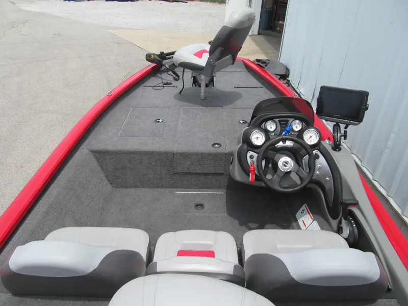 Slide: The Image of 2014 Tracker Pro Team 175 TXW boat interior with steering console and seating. - 5