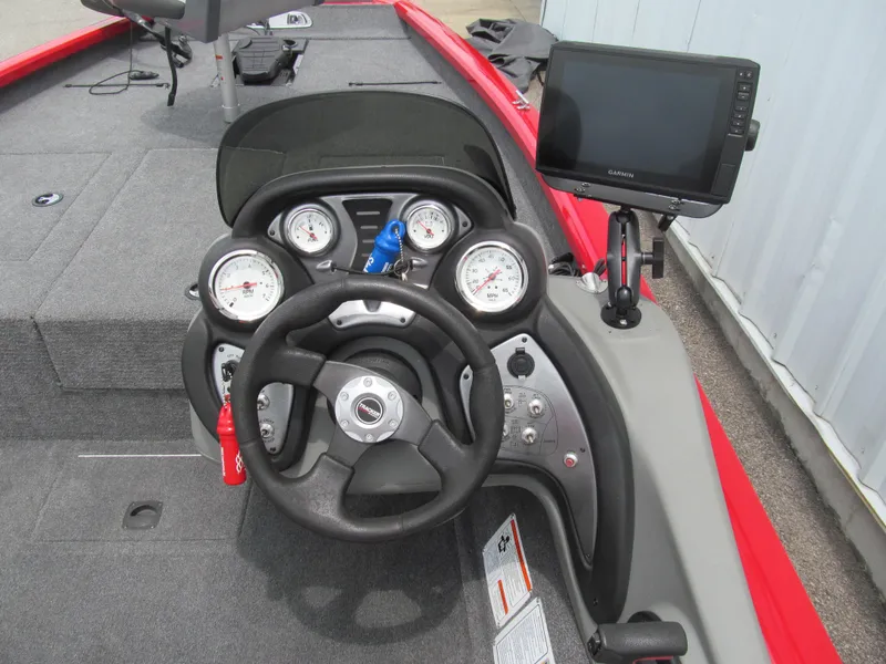 Slide: The Image of 2014 Tracker Pro Team 175 TXW boat dashboard with steering wheel and Garmin display. - 6
