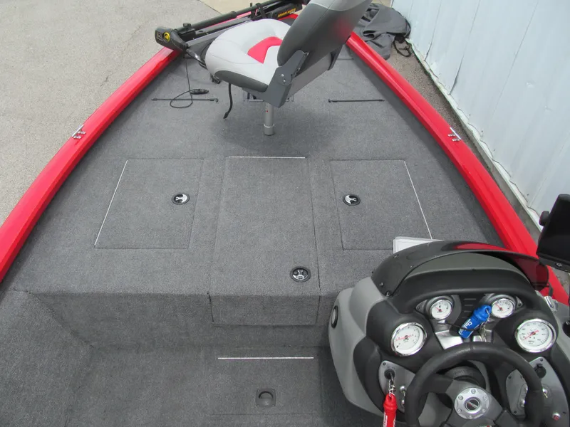 Slide: The Image of 2014 Tracker Pro Team 175 TXW boat interior with steering console and seating. - 7