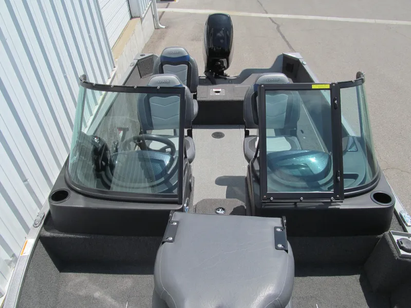 Slide: The Image of 2017 Lowe FM 165 Pro WT boat interior with dual consoles and seating. - 10