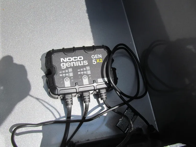 Slide: The Image of NOCO Genius GEN 5X2 battery charger on 2017 Lowe FM 165 Pro WT boat. - 12