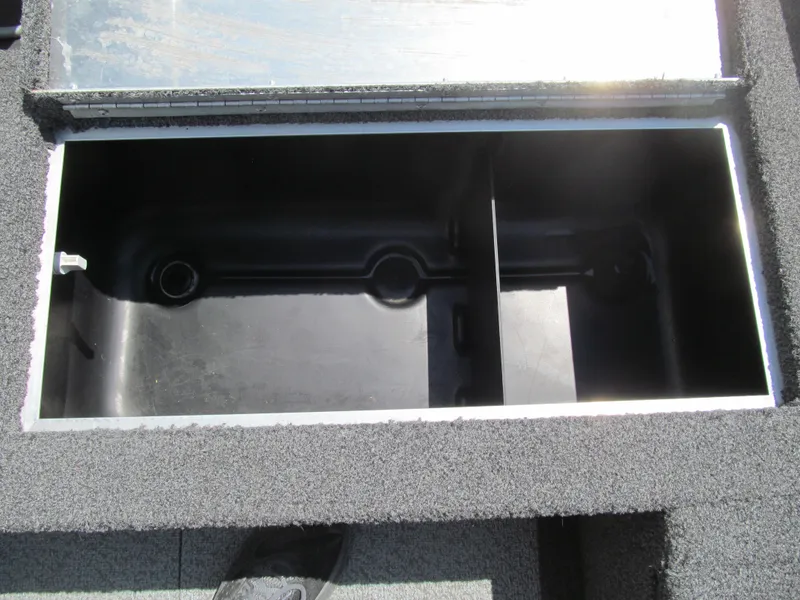Slide: The Image of Open storage compartment in 2017 Lowe FM 165 Pro WT boat. - 13