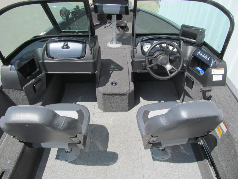 Slide: The Image of 2017 Lowe FM 165 Pro WT boat interior with dual seats and control panel. - 5