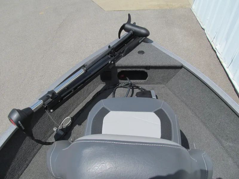 Slide: The Image of 2017 Lowe FM 165 Pro WT boat interior with trolling motor and seating. - 9