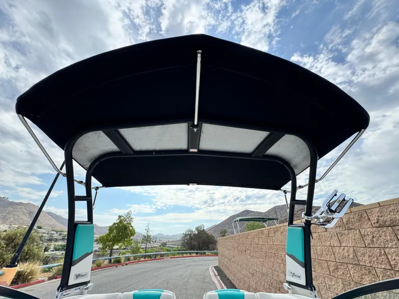 Slide: The Image of 2015 Chaparral Vortex 203 VRX boat with canopy, scenic mountain view. - 14