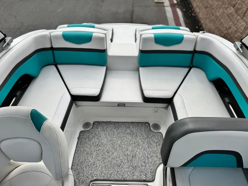 Slide: The Image of 2015 Chaparral Vortex 203 VRX boat interior with teal and white seating. - 20