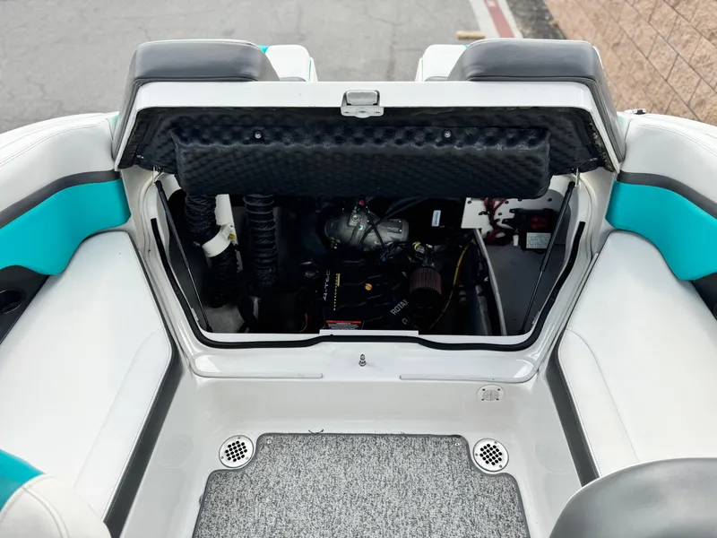 Slide: The Image of 2015 Chaparral Vortex 203 VRX engine compartment with open hatch, showcasing interior components. - 21