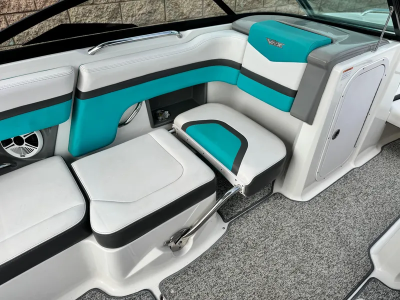Slide: The Image of 2015 Chaparral Vortex 203 VRX interior with teal and white seating, modern design. - 24