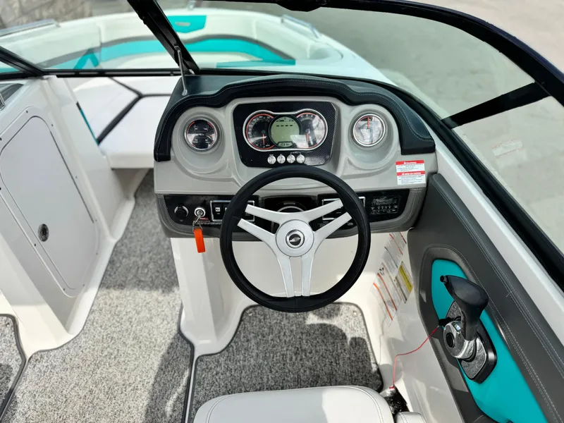 Slide: The Image of 2015 Chaparral Vortex 203 VRX boat dashboard with steering wheel and gauges. - 30
