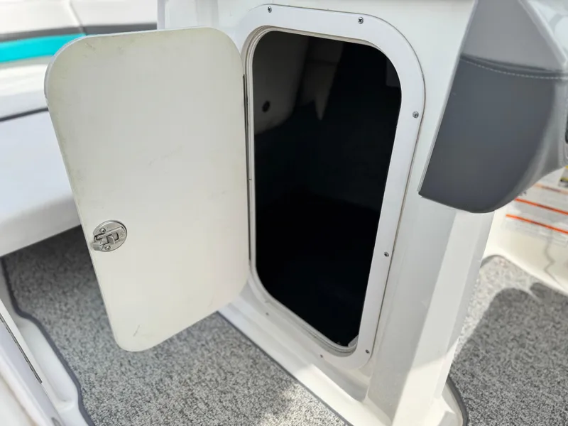 Slide: The Image of Open storage compartment on 2015 Chaparral Vortex 203 VRX boat. - 33