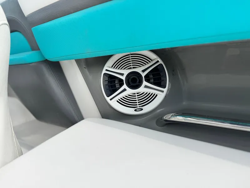 Slide: The Image of 2015 Chaparral Vortex 203 VRX boat interior speaker detail with turquoise accents. - 34