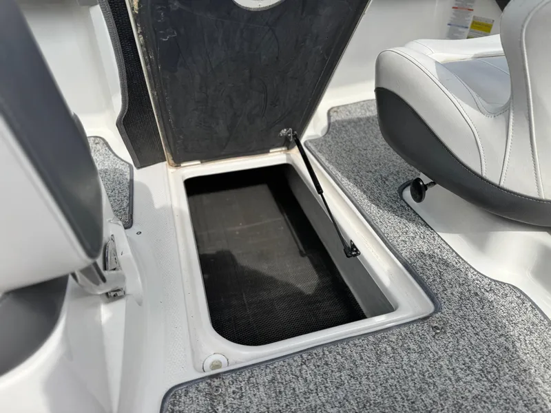 Slide: The Image of 2015 Chaparral Vortex 203 VRX boat interior storage compartment with open hatch. - 35