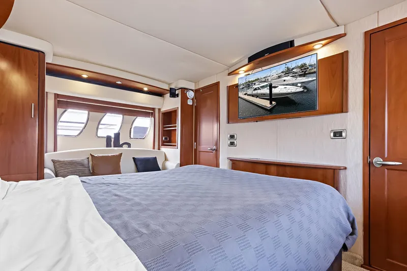 Slide: The Image of Luxurious bedroom interior of 2006 Sea Ray 60 Sundancer yacht with modern amenities. - 14