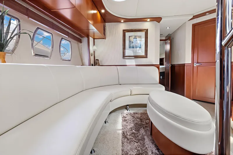 Slide: The Image of Luxurious interior of 2006 Sea Ray 60 Sundancer yacht with white leather seating and elegant decor. - 16