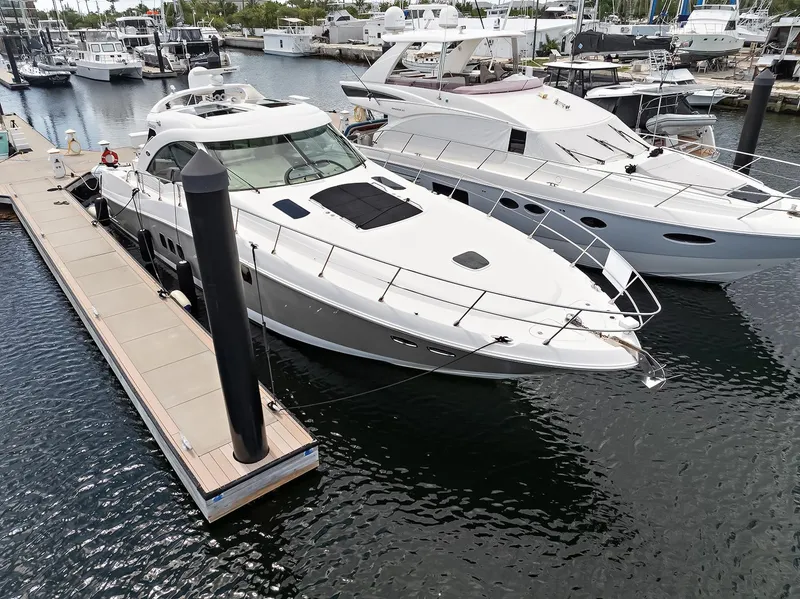 Slide: The Image of Luxury 2006 Sea Ray 60 Sundancer yacht docked at marina. - 29