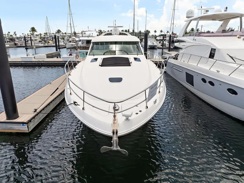 Slide: The Image of 2006 Sea Ray 60 Sundancer yacht docked at marina, front view. - 30