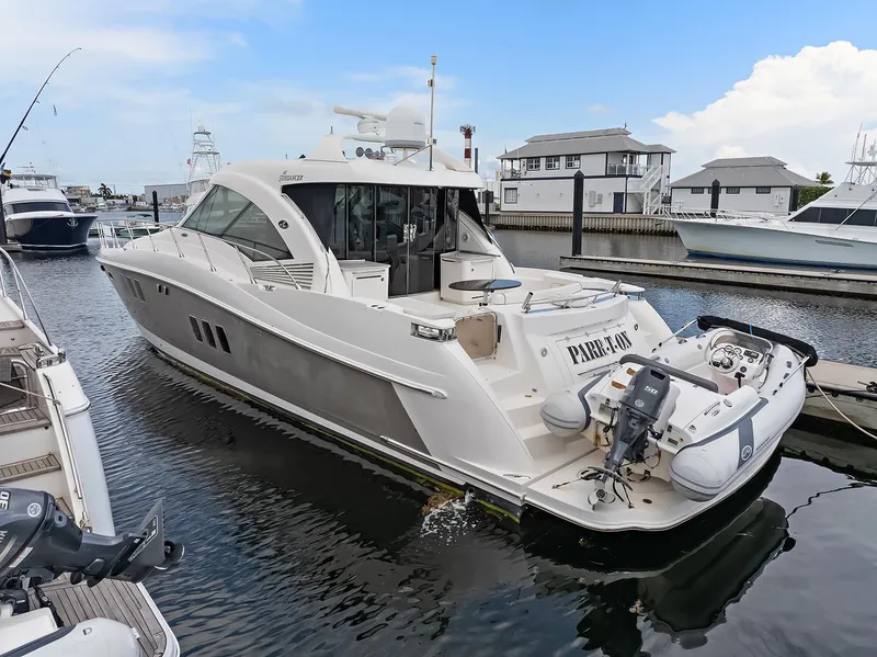 Slide: The Image of 2006 Sea Ray 60 Sundancer yacht docked with inflatable boat on stern. - 34
