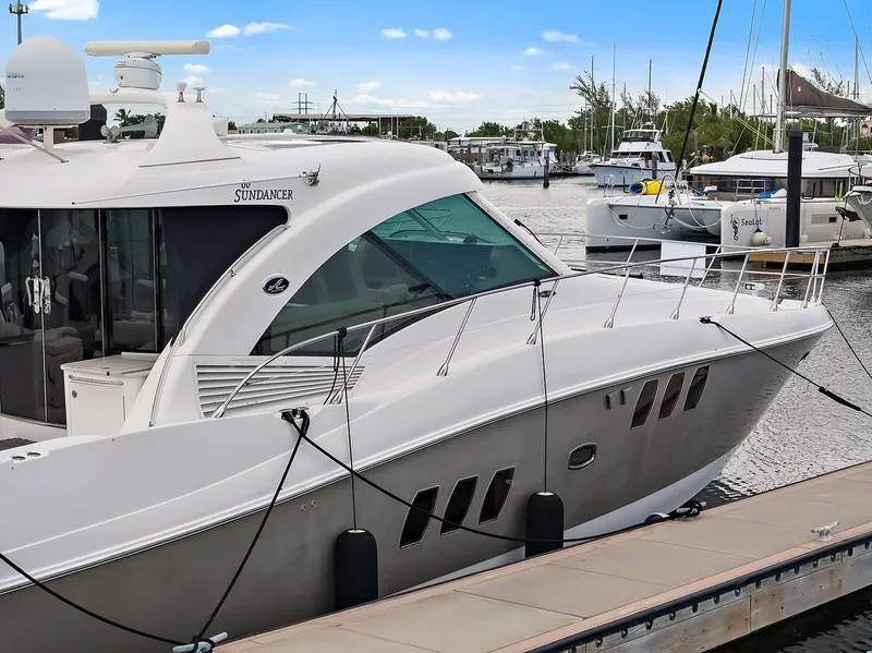Slide: The Image of 2006 Sea Ray 60 Sundancer yacht docked at marina, showcasing sleek design and luxury features. - 36