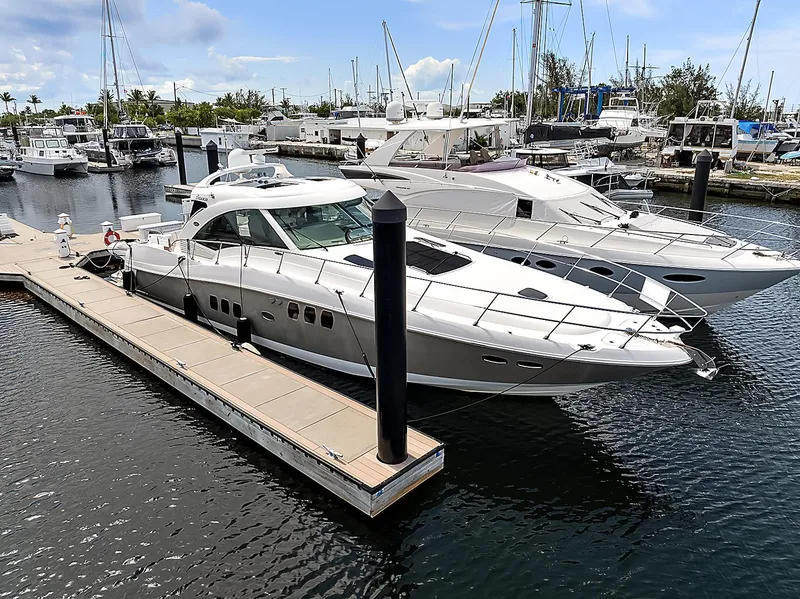 Slide: The Image of Luxury 2006 Sea Ray 60 Sundancer yacht docked at marina, surrounded by other boats. - 42