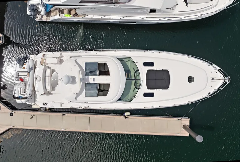 Slide: The Image of Aerial view of a 2006 Sea Ray 60 Sundancer yacht docked at a marina. - 46