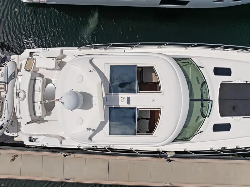 Slide: The Image of Aerial view of 2006 Sea Ray 60 Sundancer yacht docked at marina. - 48