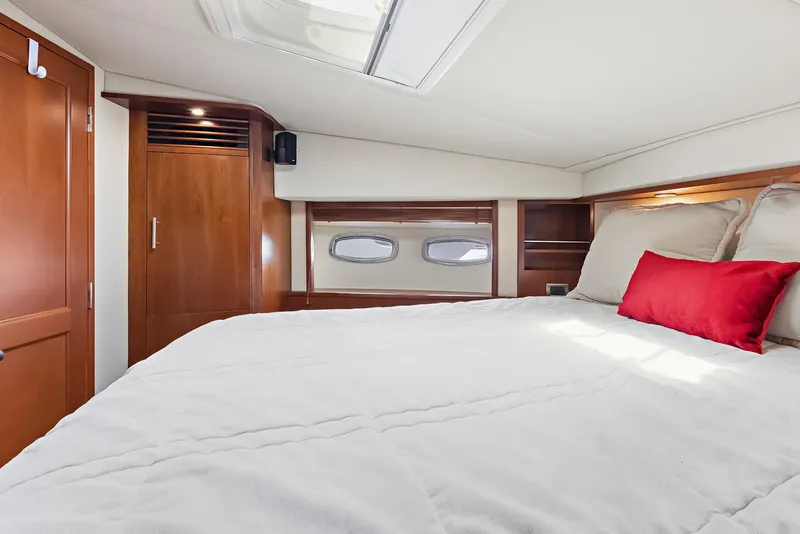 Slide: The Image of Luxurious cabin interior of 2006 Sea Ray 60 Sundancer yacht with cozy bedding. - 8