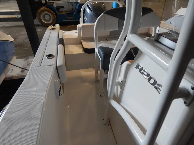 Slide: The Image of 2019 Robalo R202 Explorer boat interior with seating and console details. - 13