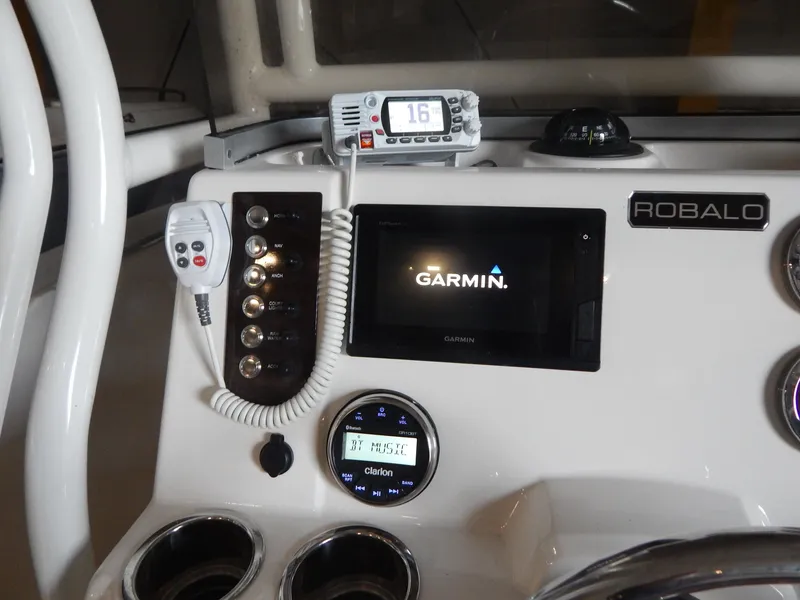 Slide: The Image of Control panel of 2019 Robalo R202 Explorer with Garmin display and radio system. - 17