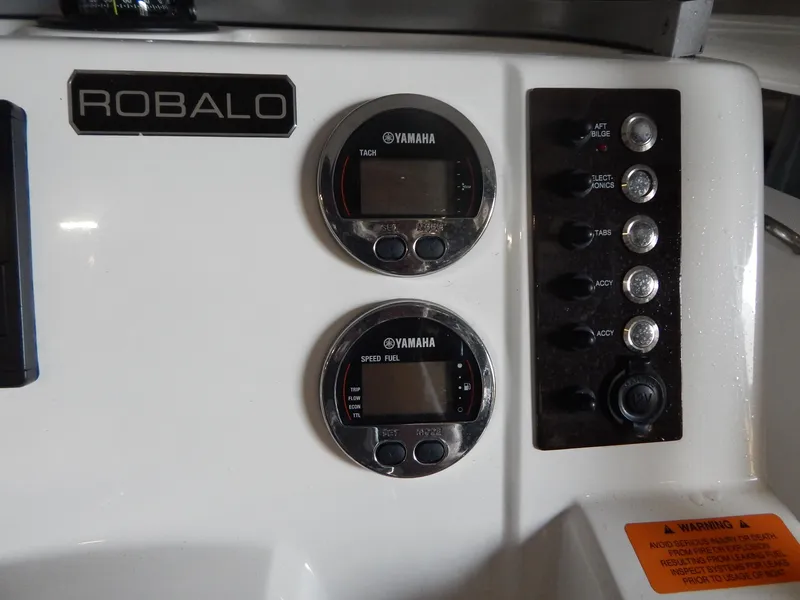 Slide: The Image of Control panel of 2019 Robalo R202 Explorer boat with Yamaha gauges and switches. - 18