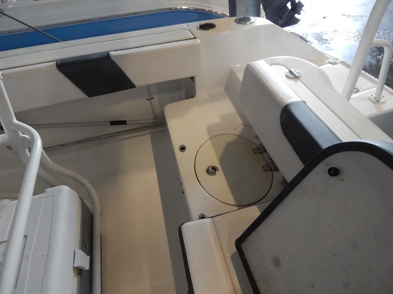 Slide: The Image of 2019 Robalo R202 Explorer boat interior with seating and storage compartments. - 23