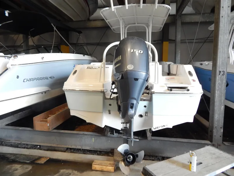 Slide: The Image of 2019 Robalo R202 Explorer boat with Yamaha 150 engine in storage. - 26