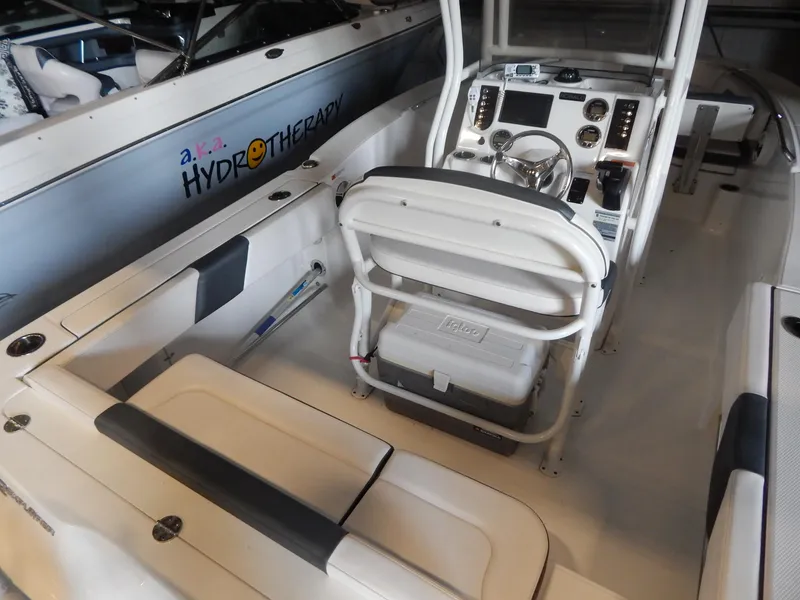 Slide: The Image of 2019 Robalo R202 Explorer boat interior with steering console and seating. - 8