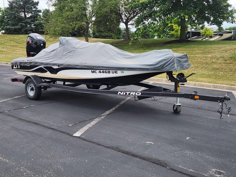 Slide: The Image of Covered 2017 Nitro Z17 boat on trailer in parking lot. - 2