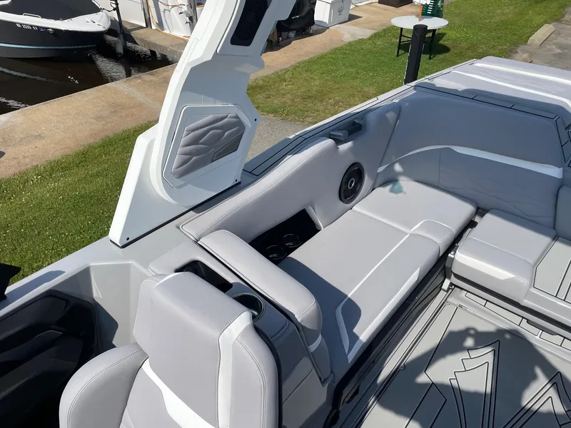 Slide: The Image of 2025 Supra SL boat interior with sleek gray seating and modern design elements. - 10