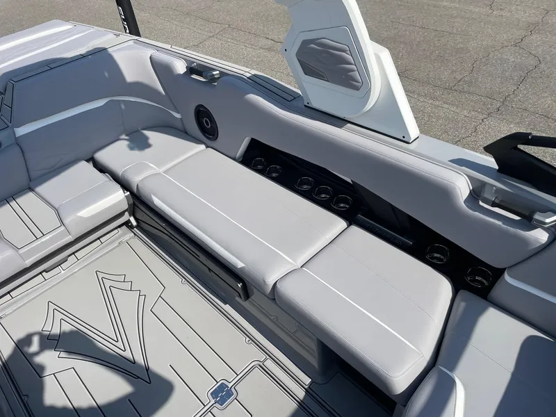 Slide: The Image of 2025 Supra SL boat interior with sleek gray seating and modern design elements. - 9